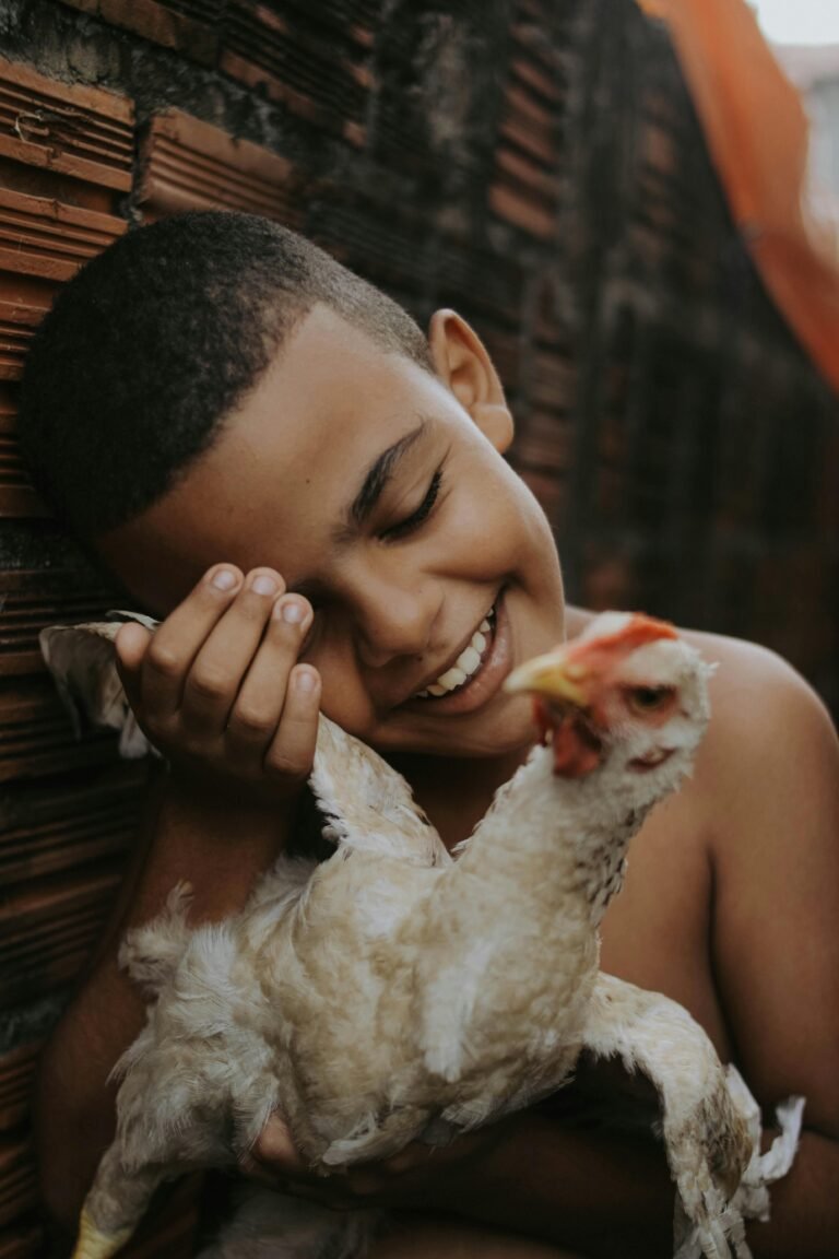 A girl holding wing of chicken